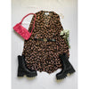 flat lay of animal print dress, pink purse, black boots
