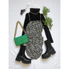 flat lay of black and white dress, green bag, black boots and black top