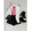 flat lay of black shorts, white jacket, pink top, black boots and black bag