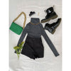 flatlay of black shorts, grey jumper, green bag and black boots