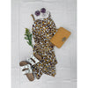 flat lay of animal print dress and yellow purse