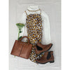 flat lay of animal print dress, white shirt and brown bag