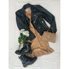 flat lay of gold dress, black leather jacket and black boots