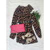 flat lay of animal print dress, pink purse and shoes