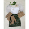 flat lay of olive mini skirt, white top, beige bag and beige boots