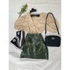 flat lay of olive mini skirt, beige top, sunglasses and shoes
