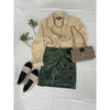 flat lay of olive mini skirt, beige top, gucchi bag and shoes